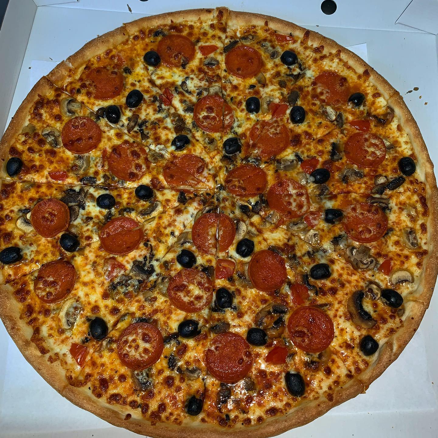 Freshly baked pepperoni, olive and mushroom pizza from Pablo's Pizza Barking